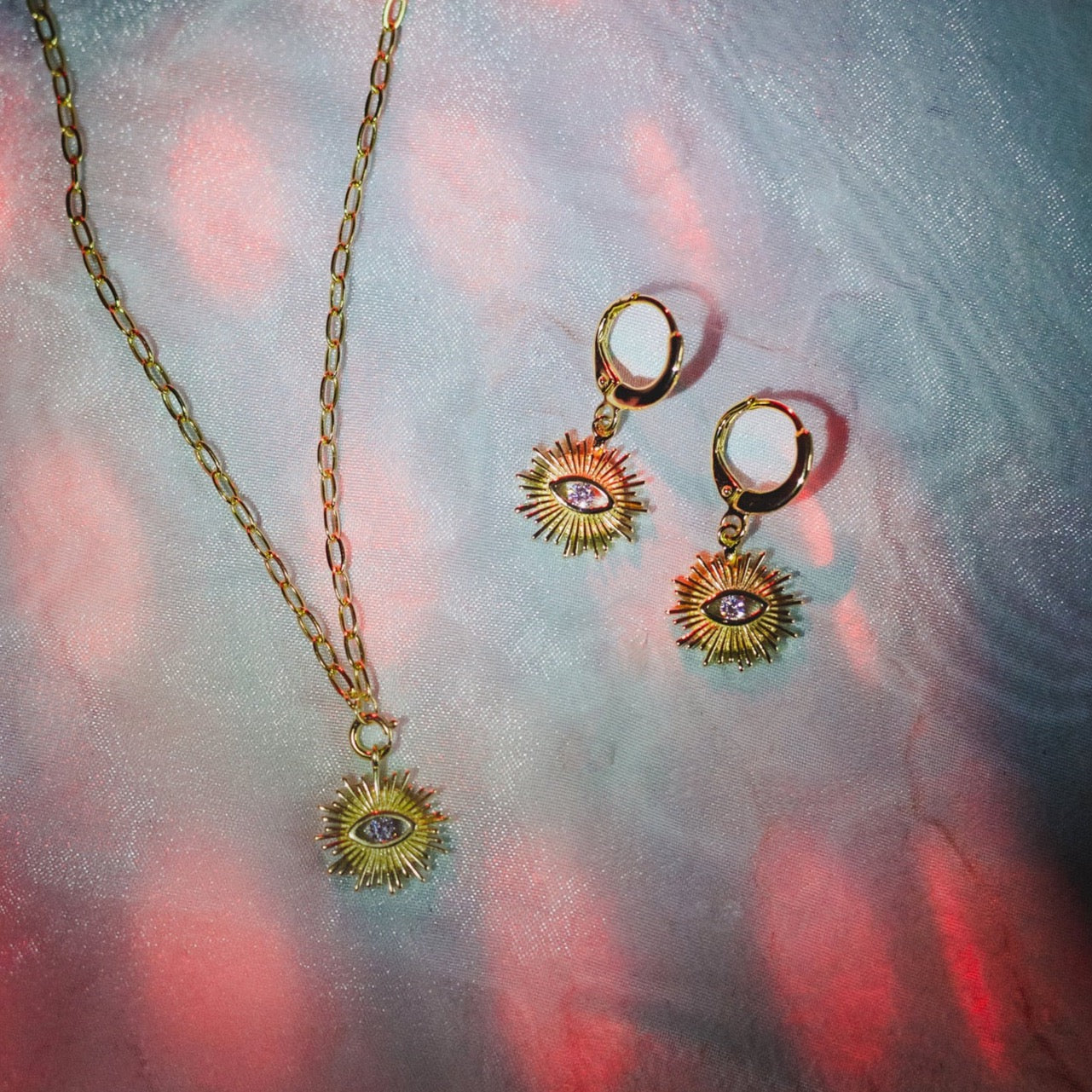 Golden Eye Huggie Earrings