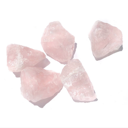 Raw pink Rose Quartz Crystals on white background